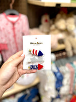 Fireworks Red & Blue Clips Lilies & Roses NY